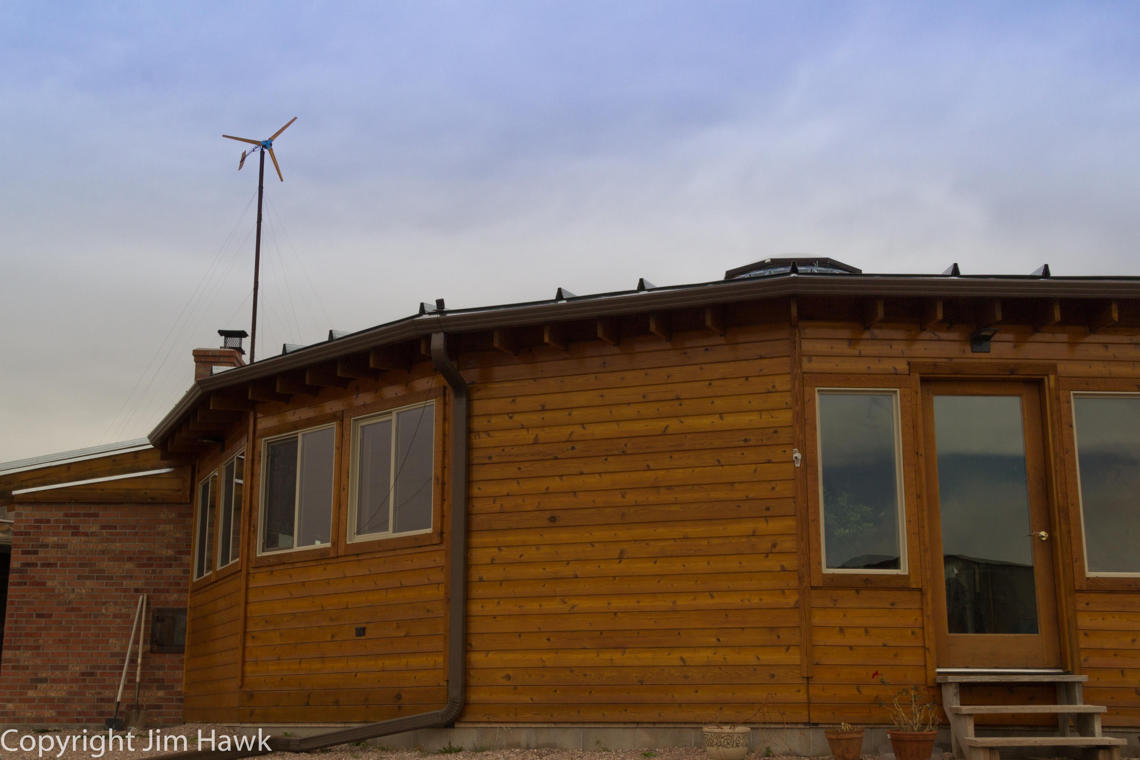 Cedar-sided wooden yurt with windows
