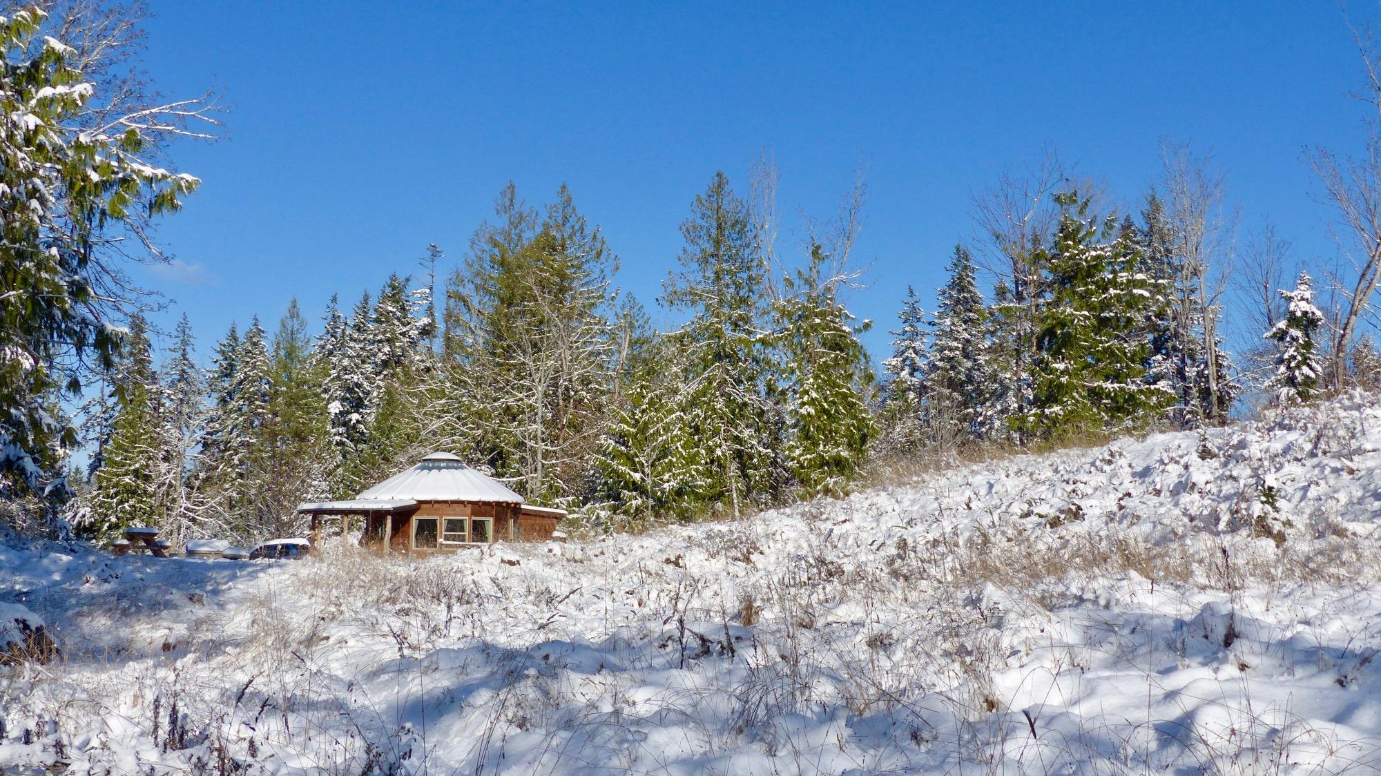 Smiling Woods wooden yurt in snow